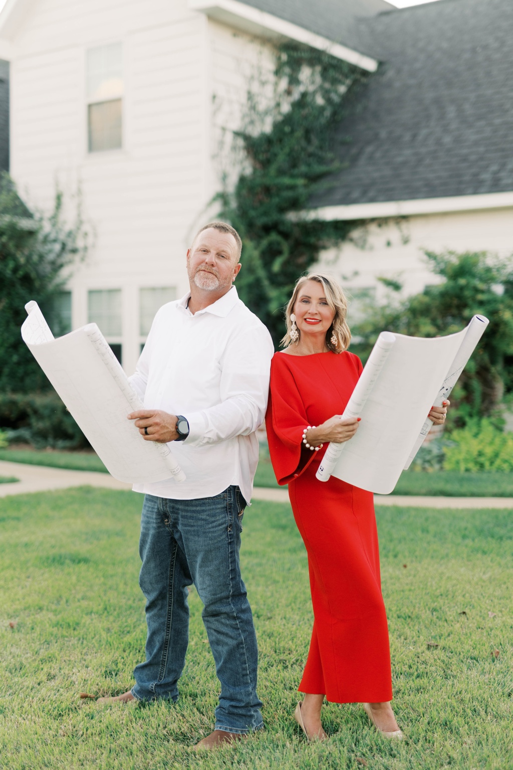 Matt and Suzanne Carden holding landscape plans